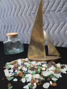 lot 52 image: VINTAGE BRASS SAIL BOAT  SEA GLASS