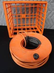 lot 152 image: CORDWHEEL WITH ELECTRICAL EXTENSION CORD  MILK CRATE