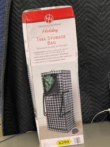 lot 5 image: Huntington Home Tree Storage Bag with Wheels
