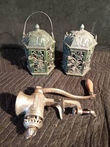 lot 47 image: Cast iron candle lanterns and a meat grinder