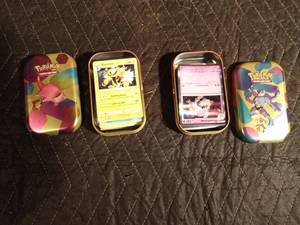 lot 64 image: 2 Pokemon tins of 50 pokemon trading cards each