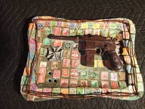lot 71 image: Replica of a WW1 German Mauser on a brass tray of German stamps