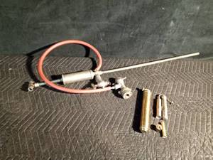 lot 147 image: Vintage beer keg tapper and vintage torches