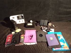 lot 484 image: External hard drive, Digital western book, Fit Bit and I phone charging station, car  phone holders, Phone and tablet cases, ear buds