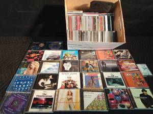 lot 463 image: Lot of CDs and a visor cd holder and 1 cassette