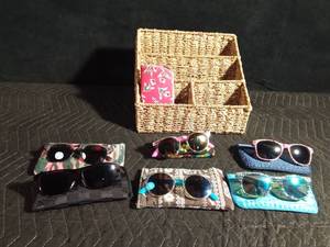 lot 98 image: Woven organizer of sunglasses and sunglass cases