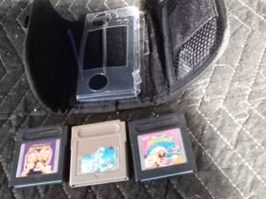 lot 195 image: Nintendo DS case with 2 stylist and 3 Nintendo Game Boy games