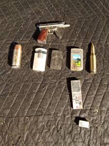 lot 191 image: 6 lighters and a tiny tin of Bon Juan razor blades