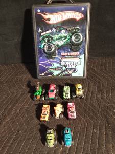 lot 193 image: Hot Wheels Gravedigger Monster Truck case with 9 Monster trucks