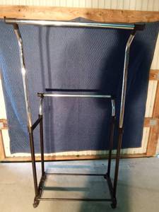 lot 180A image: Double sided adjustable clothes rack on wheels
