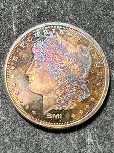 lot 46 image: 1 TROY OZ .999 FINE SILVER MORGAN DOLLAR DESIGNED ROUND TONED
