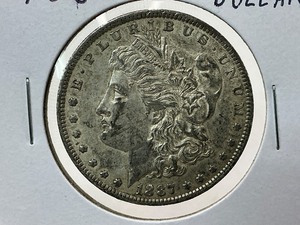 lot 103 image: 1887-O Morgan Dollar