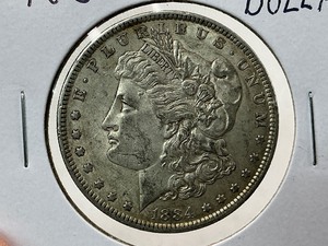 lot 105 image: 1884 Morgan Dollar