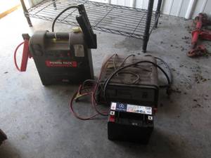 lot 24 image: Battery, battery charger and power ...