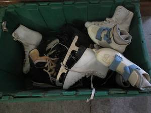 lot 39 image: Bin of ice skates, mainly kids, in ...