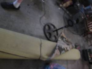 lot 53 image: Large area rug and a stand fan...