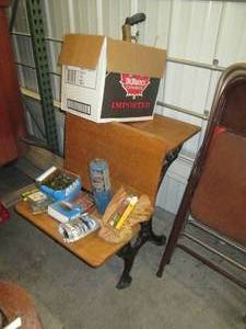 lot 93 image: Antique school desk with assorted n...
