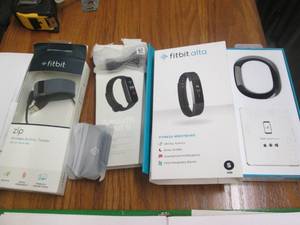lot 118 image: Lot of 2 Fitbit and one Amazfit ban...