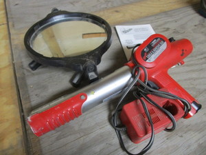 lot 129 image: Milwaukee Caulk Gun, Battery Charger