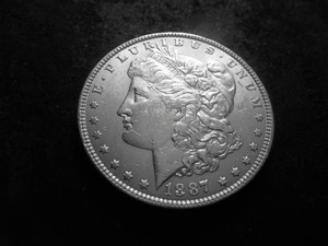 lot 13 image: 1887 Morgan Silver Dollar