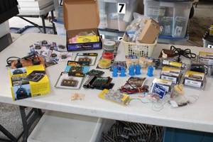 lot 57 image: Large Bin of Train Electronics 3 Transformers Switches, wire, Joiners lights and more