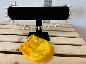 lot 148-J2025 image: 28-Piece 16 Natural Earth-Tone Baroque Freshwater Pearl Necklace  with Yellow Silk Dragon Satchel