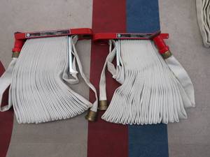 lot 60 image: 2 FIRE HOSES WITH HANGING RACK