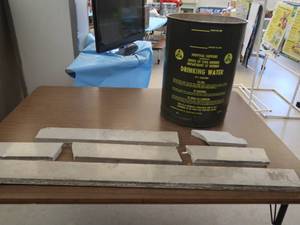 lot 208 image: GRANITE PIECES WITH VINTAGE METAL CAN