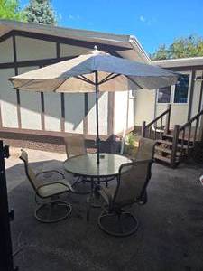 lot 2 image: Patio Set with Glass Top Table, Chairs, and Umbrella