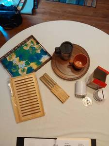 lot 75 image: Kitchen Items including Knives, Farberware Meat Tenderizer, Wicker Tray, and Bamboo Bread Slicer