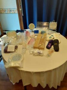 lot 122 image: Lot of Household and Personal Care Items including Avon Shower Brush, Slippers, and Mirror