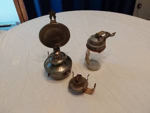 lot 148 image: Antique Oil Lamps and Glass Jar with Metal FlameOut Lid