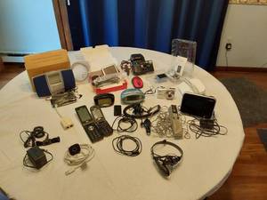 lot 164 image: Assorted Electronics and Accessories including Flip Phones, Portable FM Scan Radio, TomTom GPS, and Digital Picture Viewer