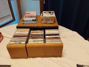 lot 195 image: Lot of Music CDs and Audio Books including Michael J. Fox Audiobook, Various Artists Greatest Hits, and Celine Dion, Kenny Chesney, and LeAnn Rimes
