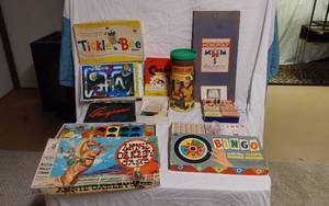 lot 220 image: Board games including Annie Oakley Game, Tickle Bee, Monopoly, and Lincoln Logs