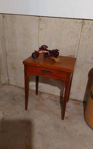 lot 248 image: Vintage Wooden Sewing Machine Table with Red Toy Motorcycle