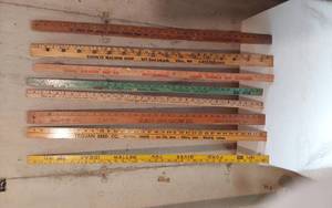 lot 282 image: Vintage Wooden Yardsticks Including Trojan, Ford and Sears