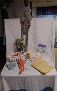 lot 296 image: Childrens Toys including Stuffed Animal, Plastic Shopping Cart, and Knitted Hats