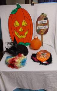 lot 304 image: Halloween Decorations Including Pumpkin Sign, Witch Hat, and Mask