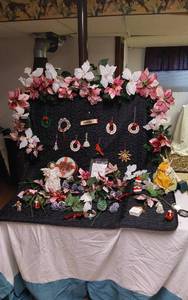 lot 326 image: Lot of Holiday Decorations and Ornaments Various holiday decorations including poinsettia garlands, handmade ornaments, and angel figurines