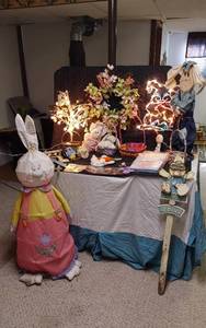 lot 343 image: Easter and Spring Decoration Lot such as light-up bunny figures, floral arrangements, Easter baskets with eggs, and plush bunnies