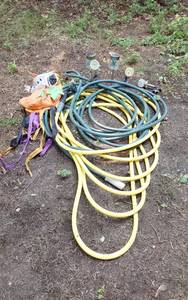 lot 417 image: Garden hoses, nozzle, and solar lights