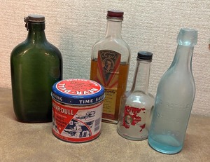 lot 119 image: Vintage Glass Bottles and Never-Dull Tin