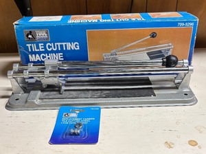 lot 197 image: Tool Shop Tile Cutting Machine with New Replacement Carbide Tile Cutting Wheel