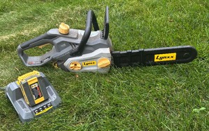lot 280 image: Lynx Chainsaw Model 63287 with Two Batteries and Charger