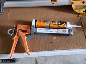 lot 235 image: HDX 10-oz Caulk Gun with Tube of Gorilla Glue Heavy Duty Construction Adhesive