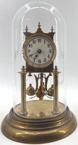 lot 373 image: Antique Brass Glass Dome Clock with Rotating Pendulum