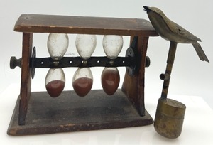lot 425 image: Antique Rotating Wooden Hourglass Timer and Cast Brass Bird Whistle