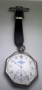lot 434 image: Vintage Chevrolet Octagonal Pocket Watch with Leather Strap and Badge