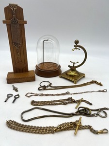 lot 439 image: Collection of Antique Pocket Watch Chains, Stands, Glass Dome, and Winding Keys